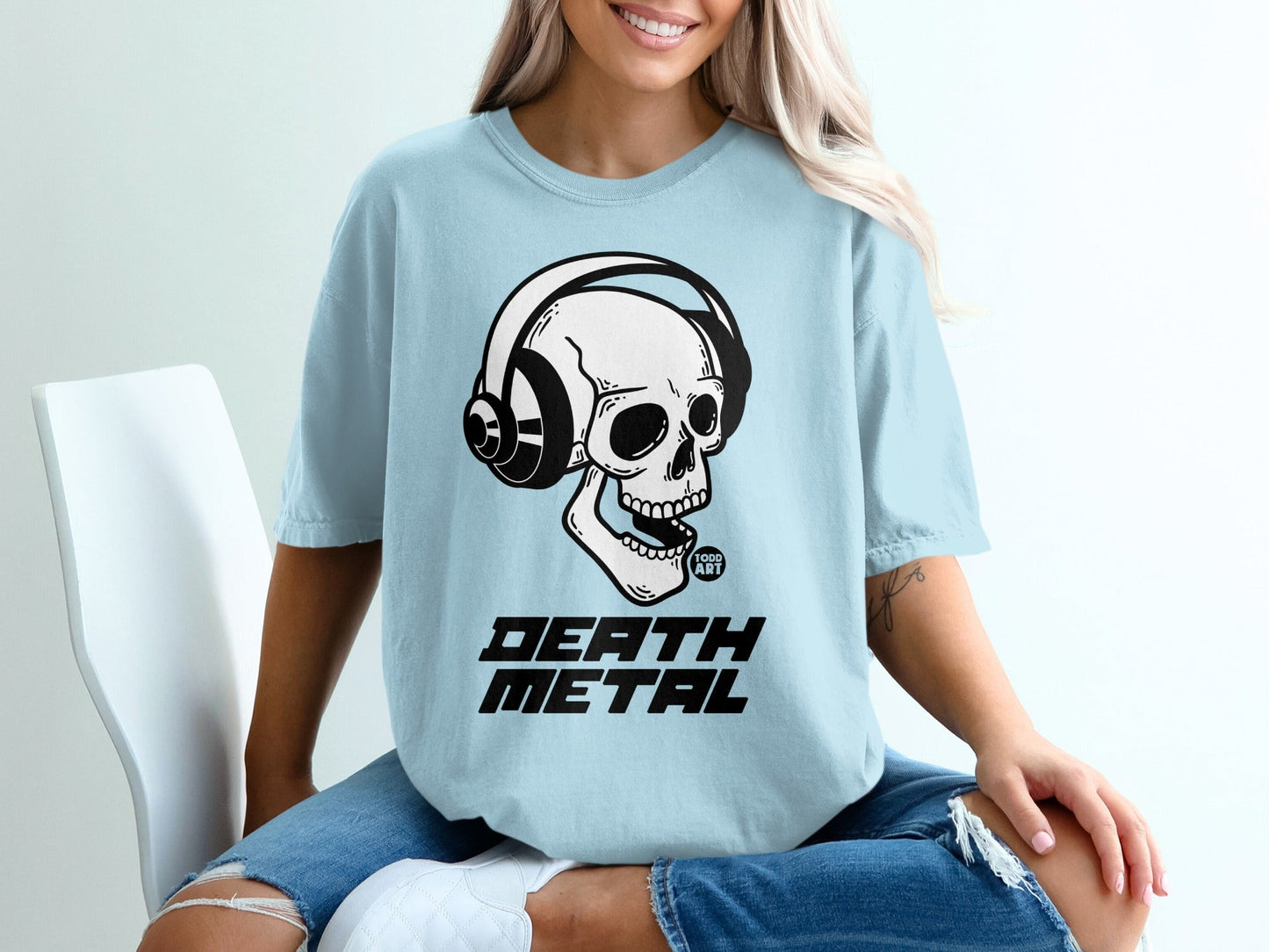 Light blue t-shirt with skull wearing headphones and "DEATH METAL" text.