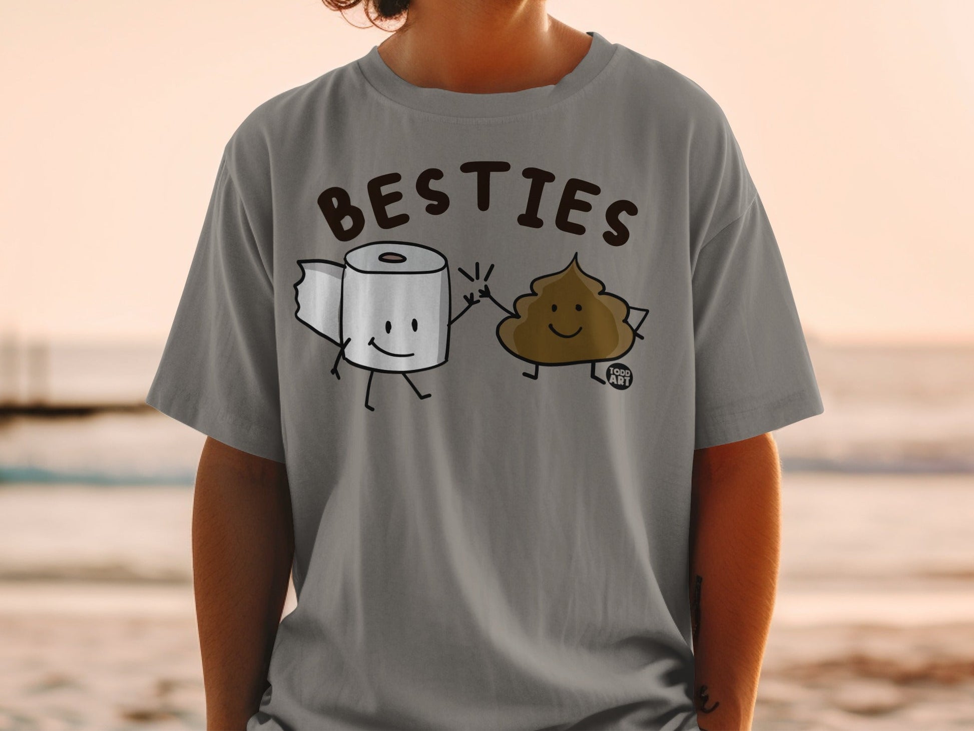 T-shirt with cartoon toilet paper and poop characters high-fiving.