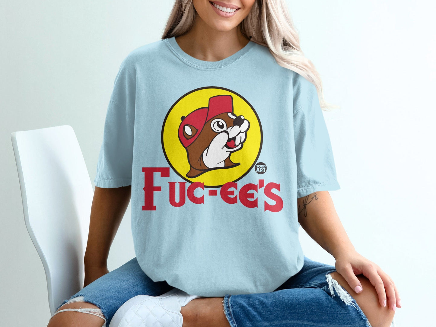 Light blue t-shirt with Bucee's beaver logo and text.