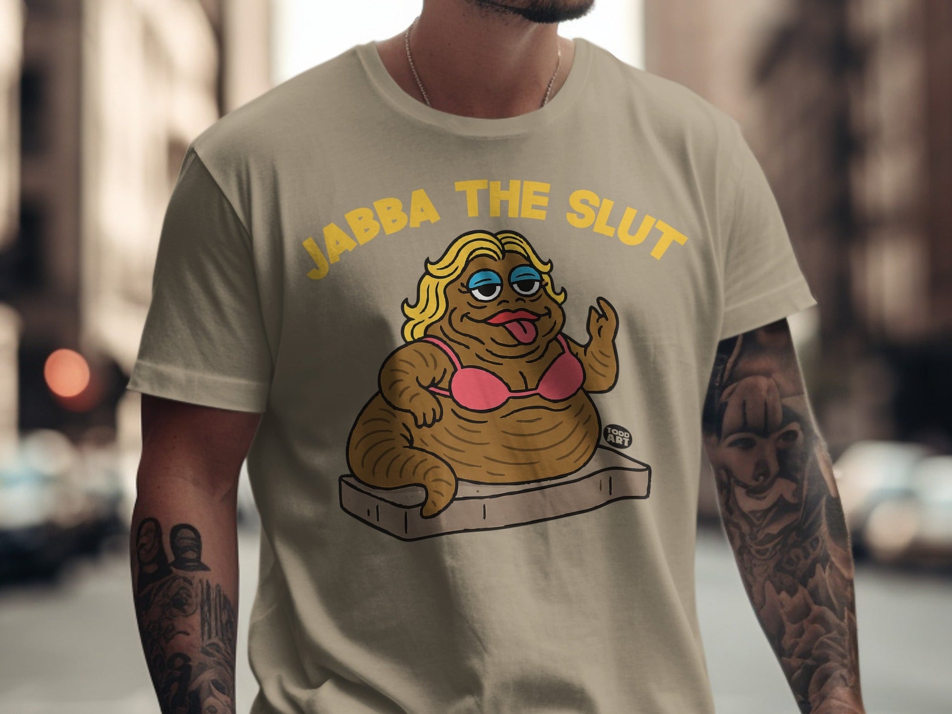 T-shirt with cartoon of a caricature labeled "JABBA THE SLUT".