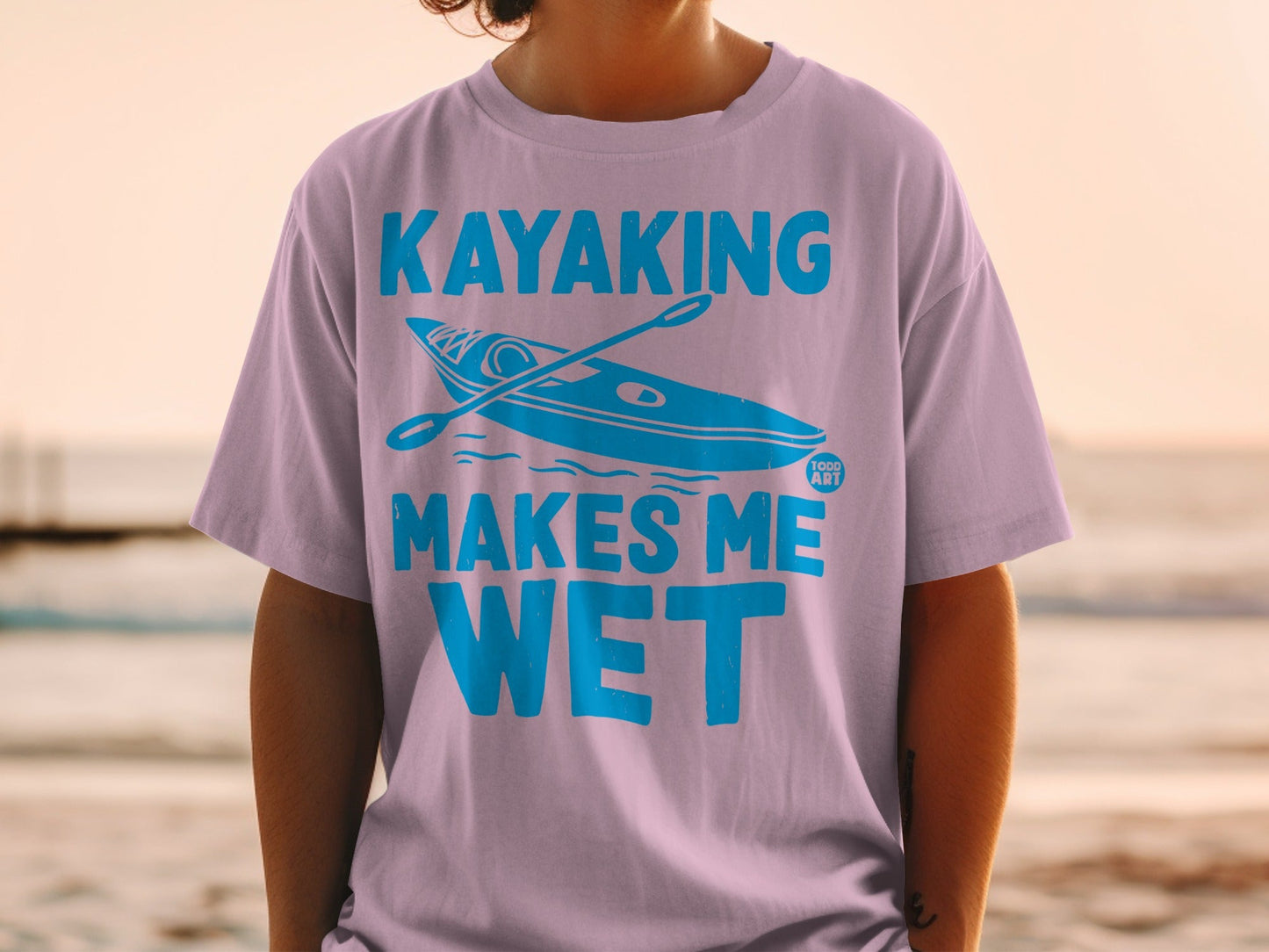 T-shirt with "Kayaking Makes Me Wet" text and kayak graphic.