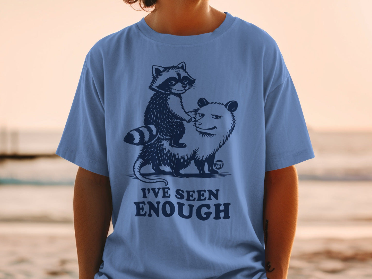 T-shirt with raccoon riding opossum, text "I'VE SEEN ENOUGH".