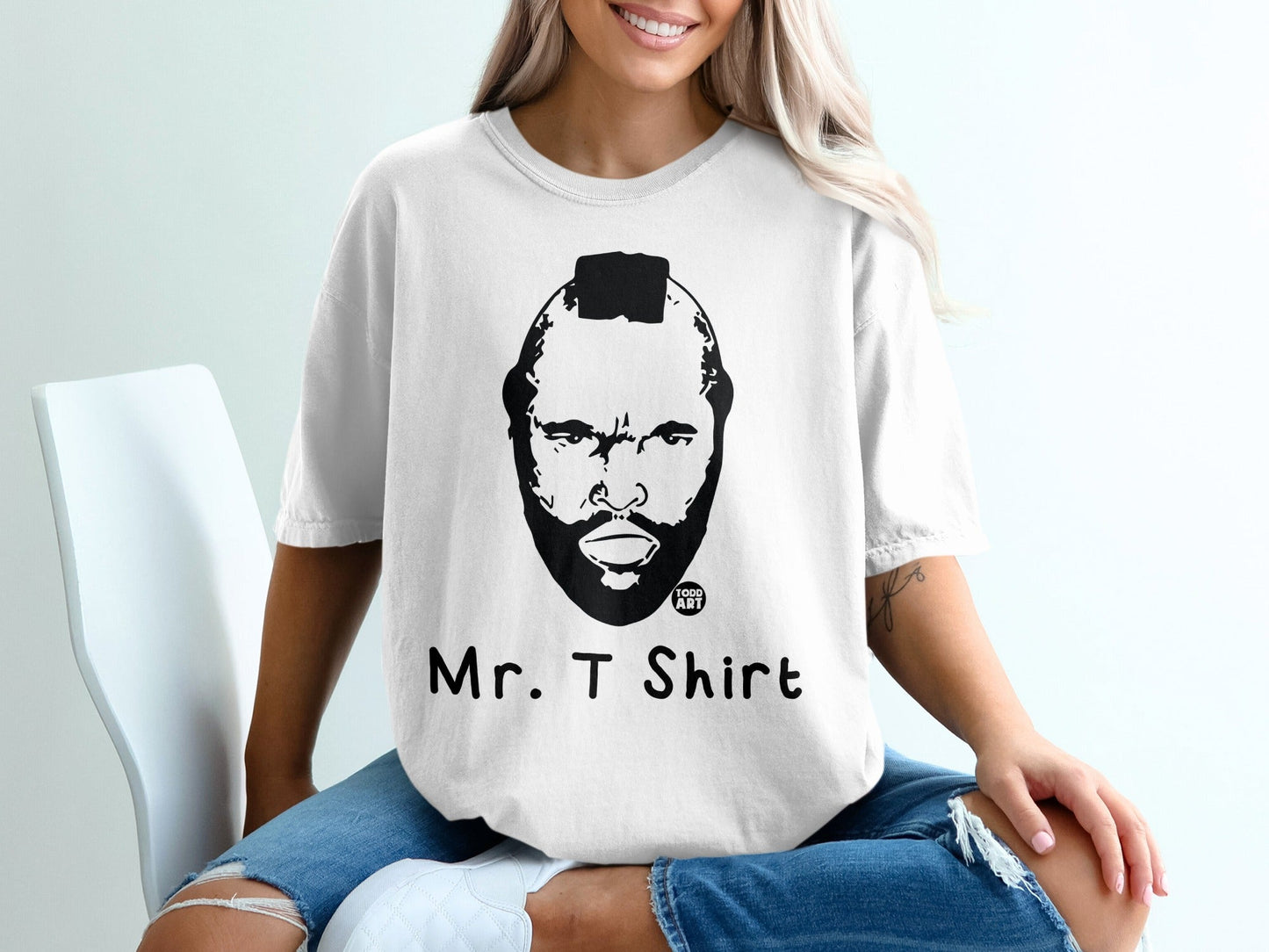 White t-shirt with a black and white portrait of Mr. T and his name.