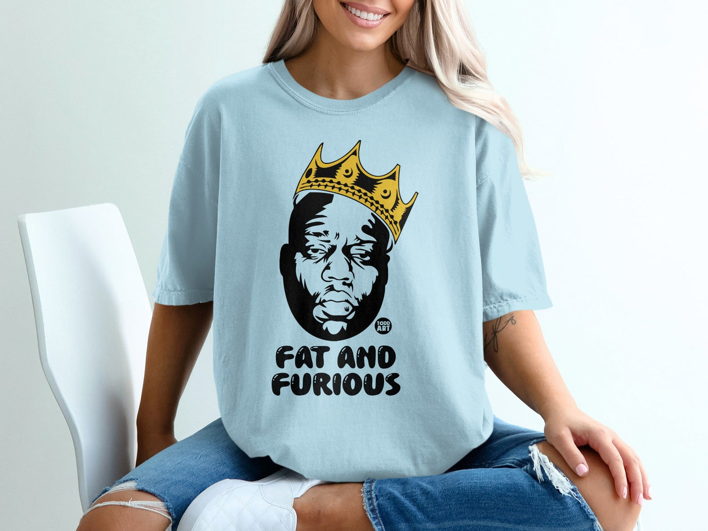 Light blue t-shirt with Biggie Smalls graphic and "FAT AND FURIOUS" text.