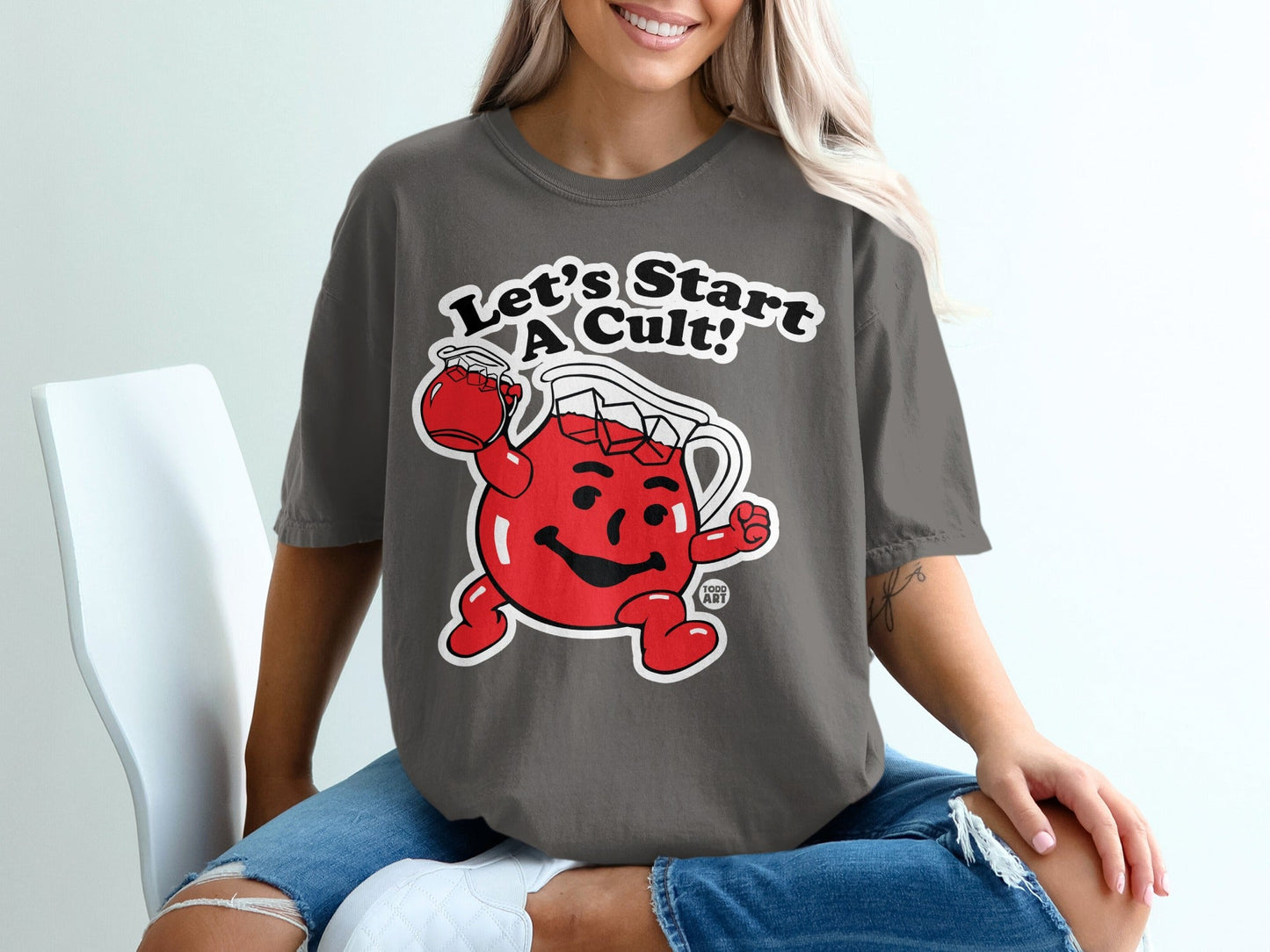 T-shirt featuring cartoon Kool-Aid Man with "Let's Start a Cult!" text.