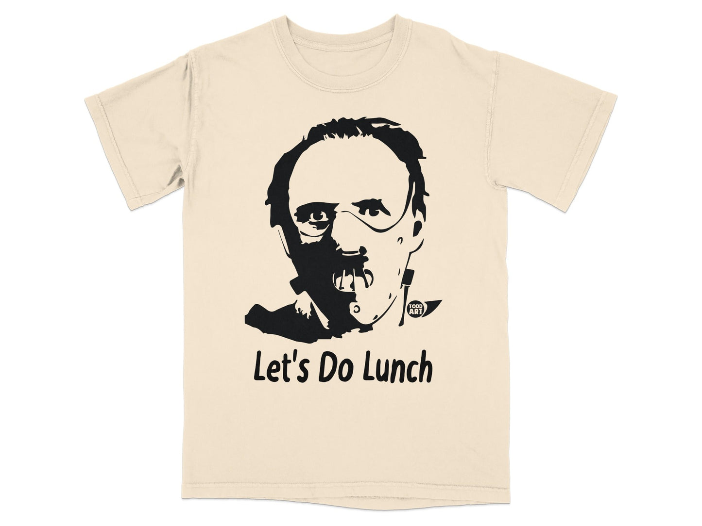 Cream t-shirt with black graphic of a man's face and text "Let's Do Lunch".