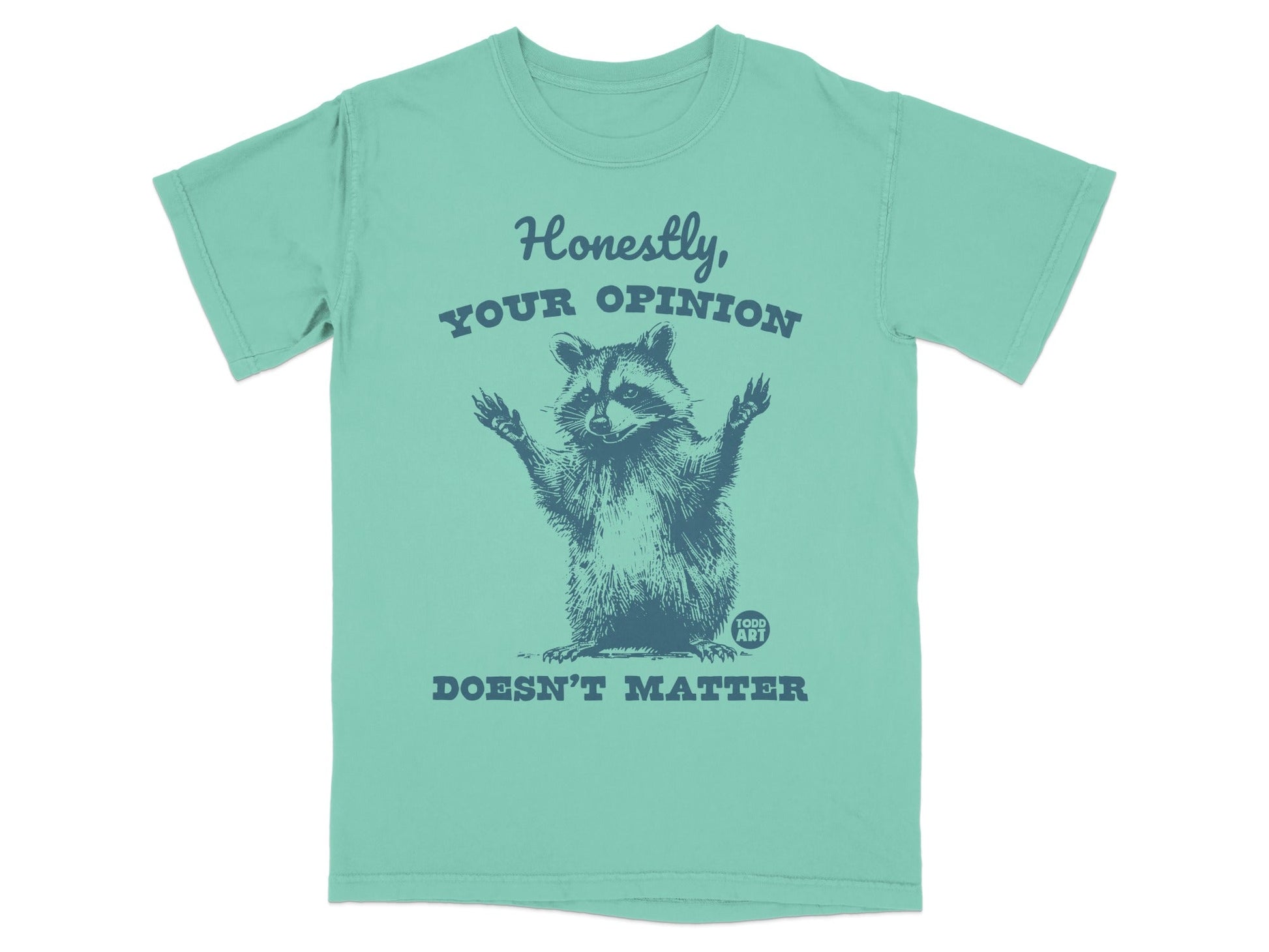 T-shirt graphic: raccoon with arms raised, text "Honestly, your opinion doesn't matter."