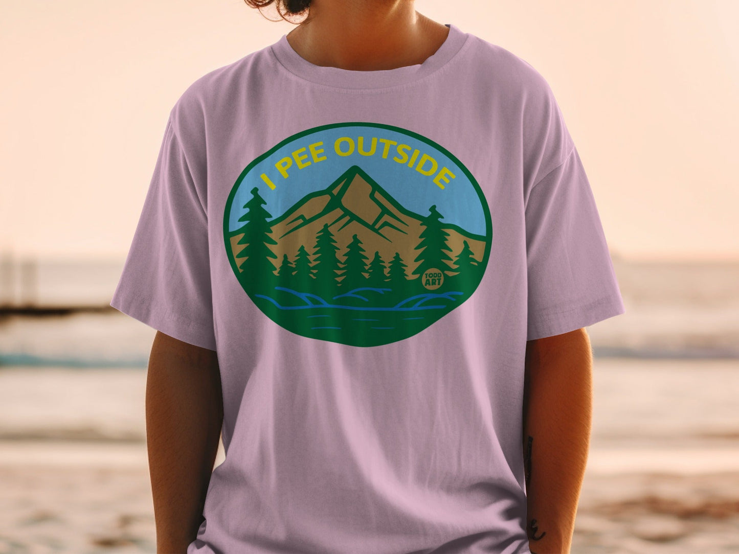 T-shirt with a circular graphic of mountains, trees, and water.