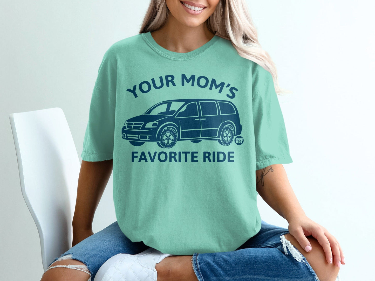Teal t-shirt with "Your Mom's Favorite Ride" and a car graphic.
