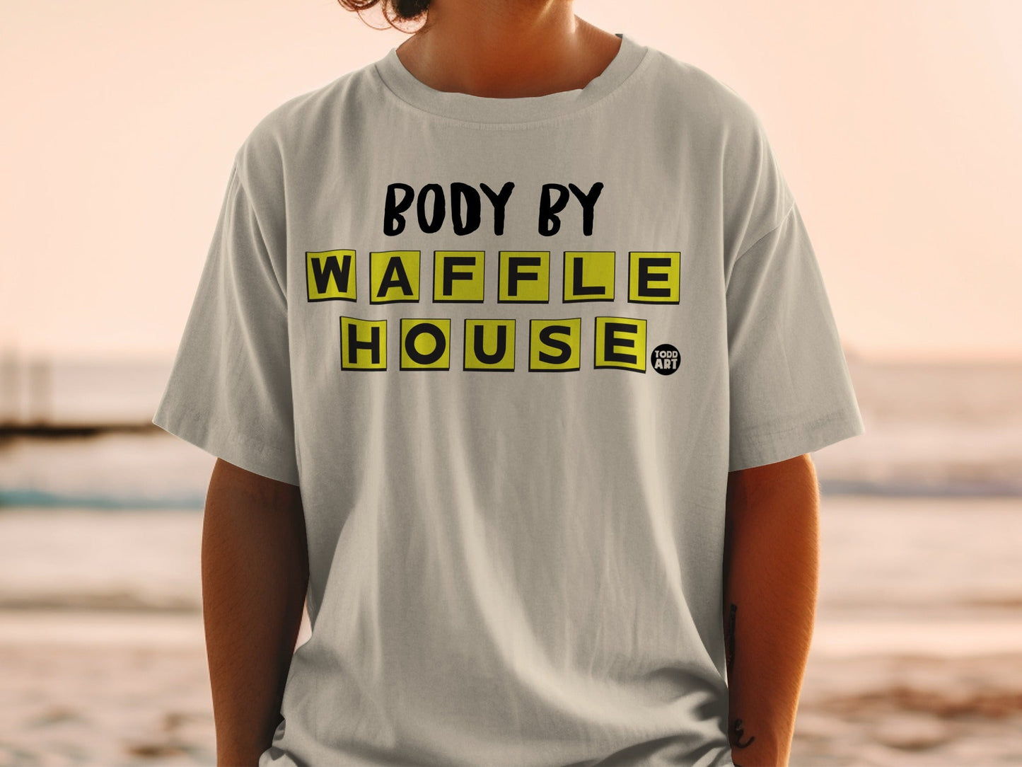Grey t-shirt with "BODY BY WAFFLE HOUSE" text and a small logo.