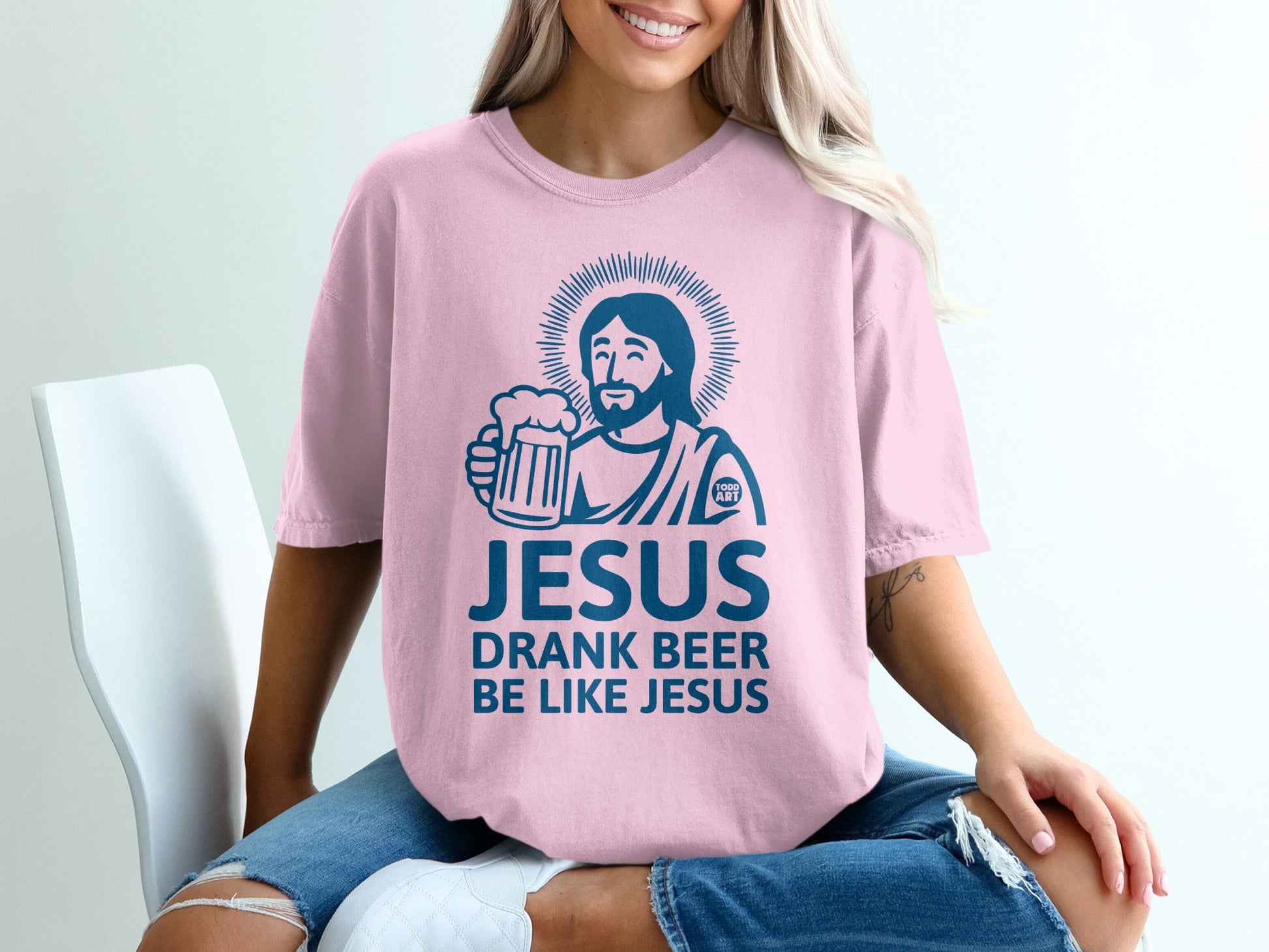 Pink t-shirt with "JESUS DRANK BEER LIKE JESUS" and a graphic of Jesus holding a beer.