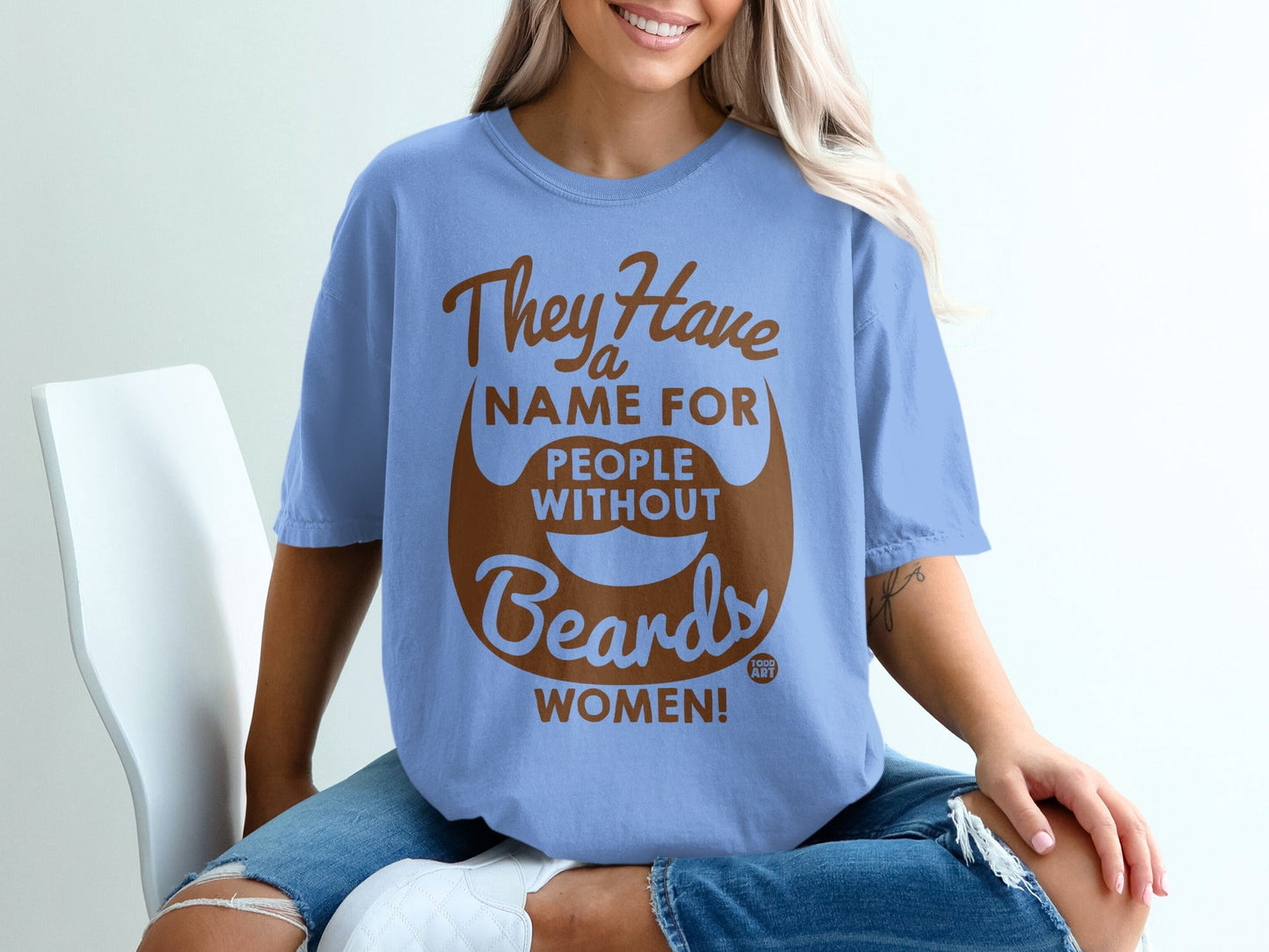 Light blue t-shirt with "They Have a Name For People Without Beards: WOMEN!" text.