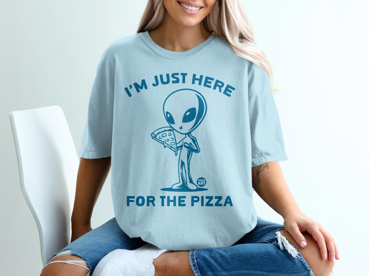 Light blue t-shirt with alien holding pizza and text "I'M JUST HERE FOR THE PIZZA".