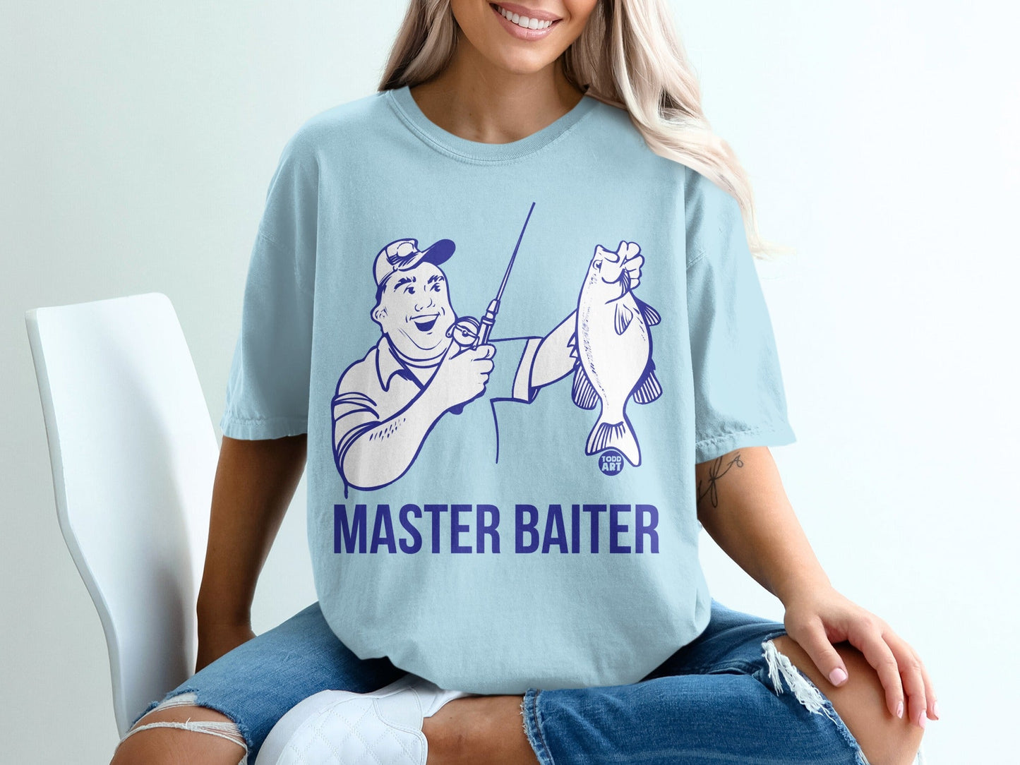 Light blue t-shirt with "MASTER BAITER" text and cartoon fisherman holding a fish.