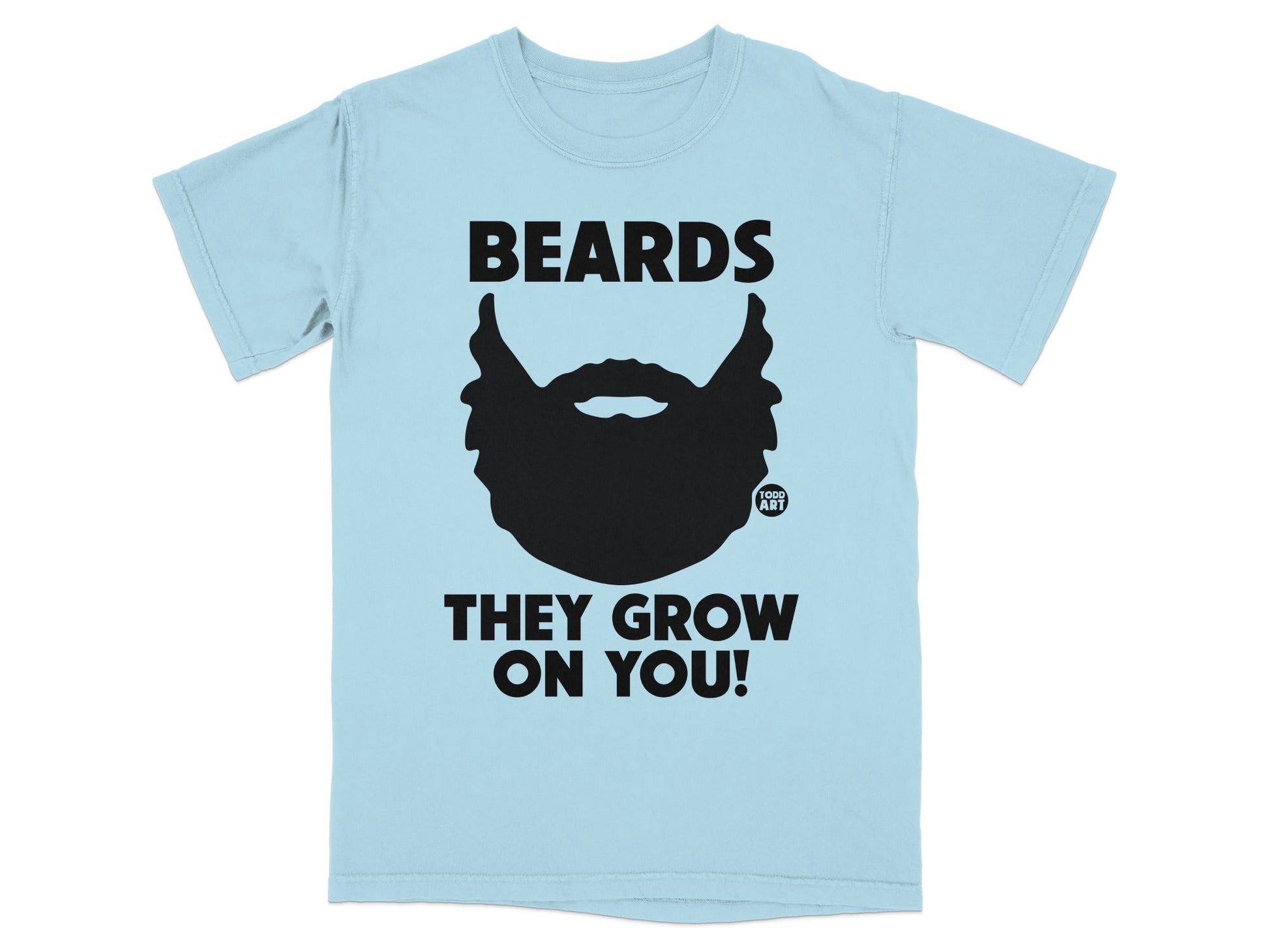 Light blue t-shirt with black text and beard graphic: "BEARDS THEY GROW ON YOU!"