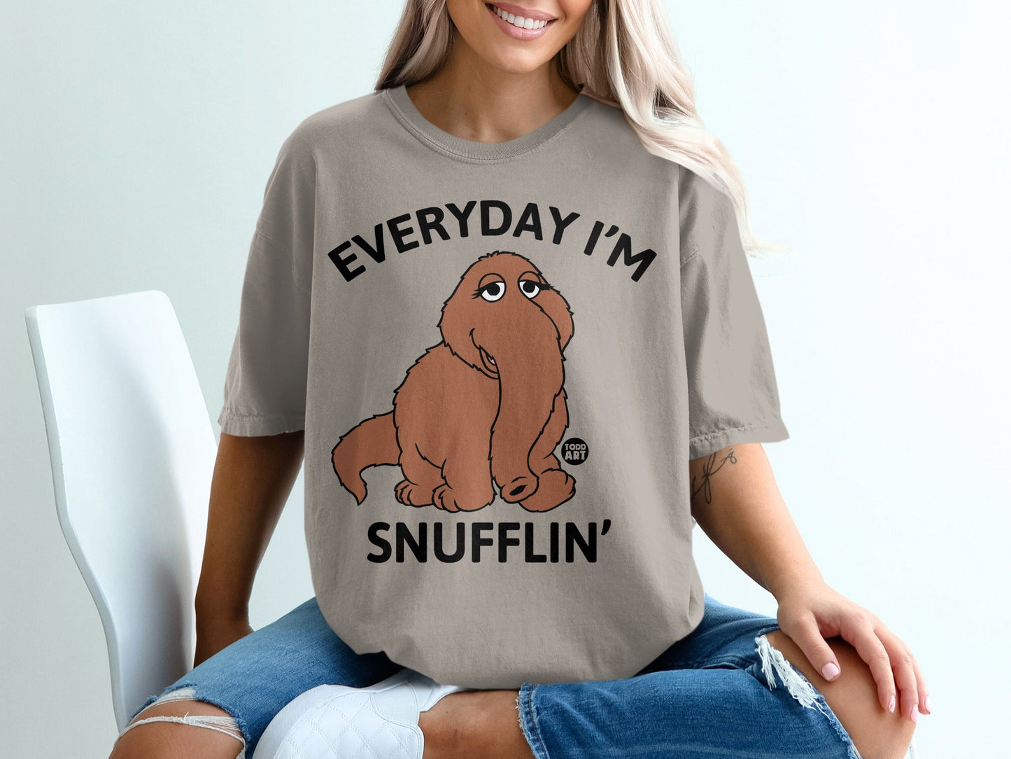T-shirt with "EVERYDAY I'M SNUFFLIN'" text and cartoon elephant character.