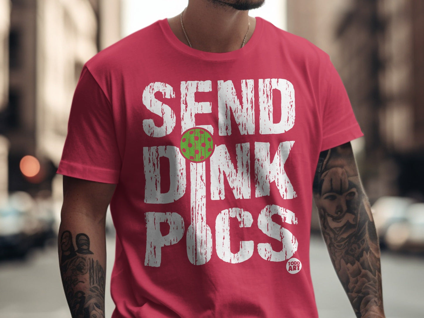 Red t-shirt with "SEND DINK PICS" and a pickleball graphic.