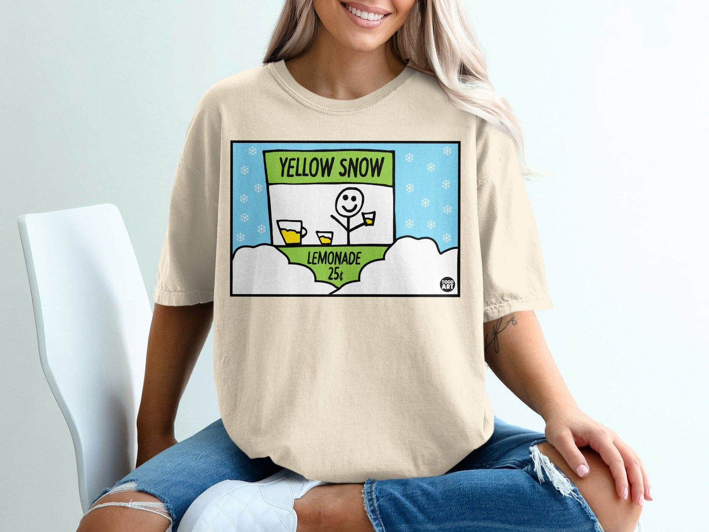 T-shirt with yellow snow lemonade stand graphic and text.