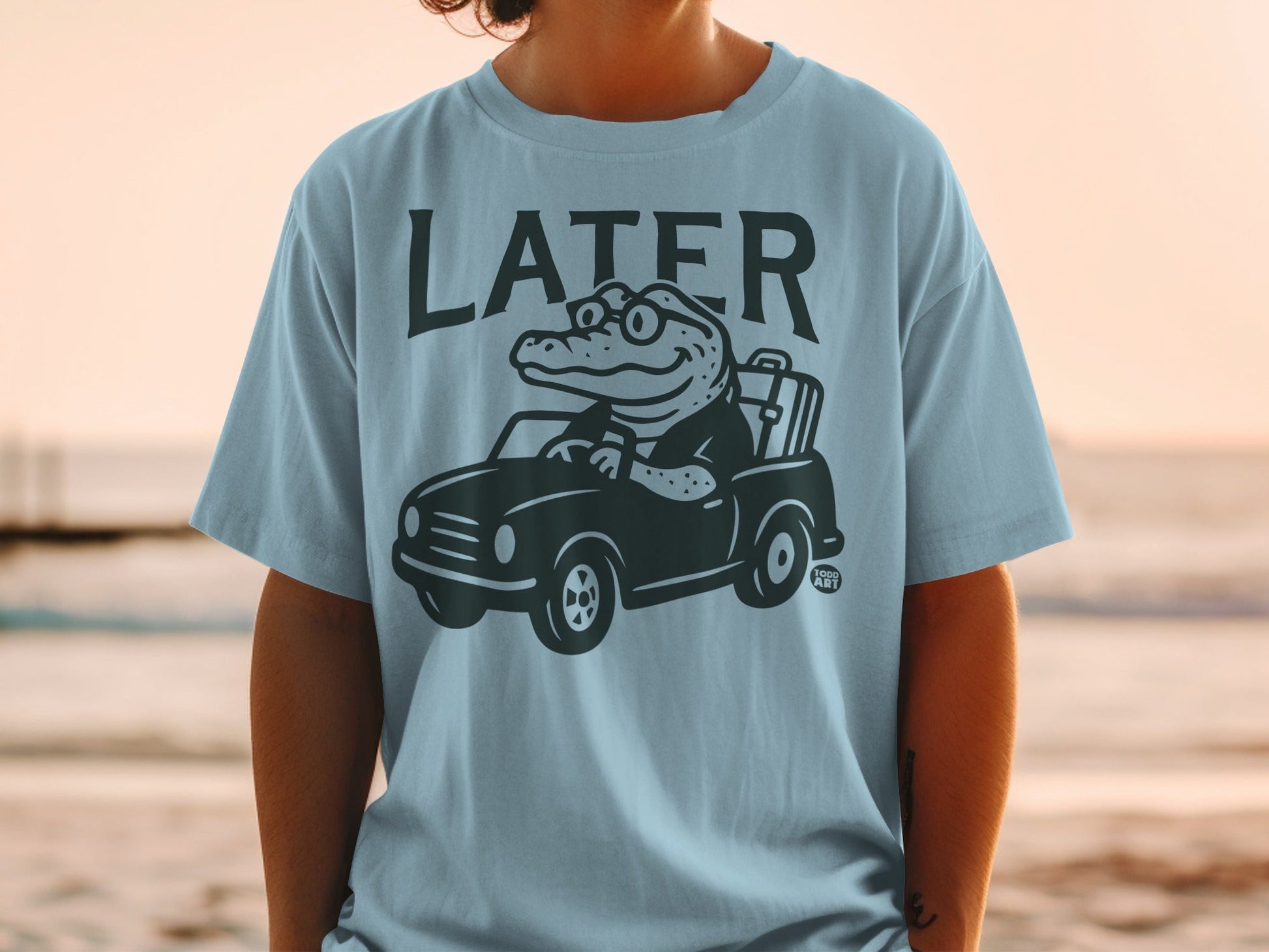 Cartoon alligator driving a car with "LATER" text.