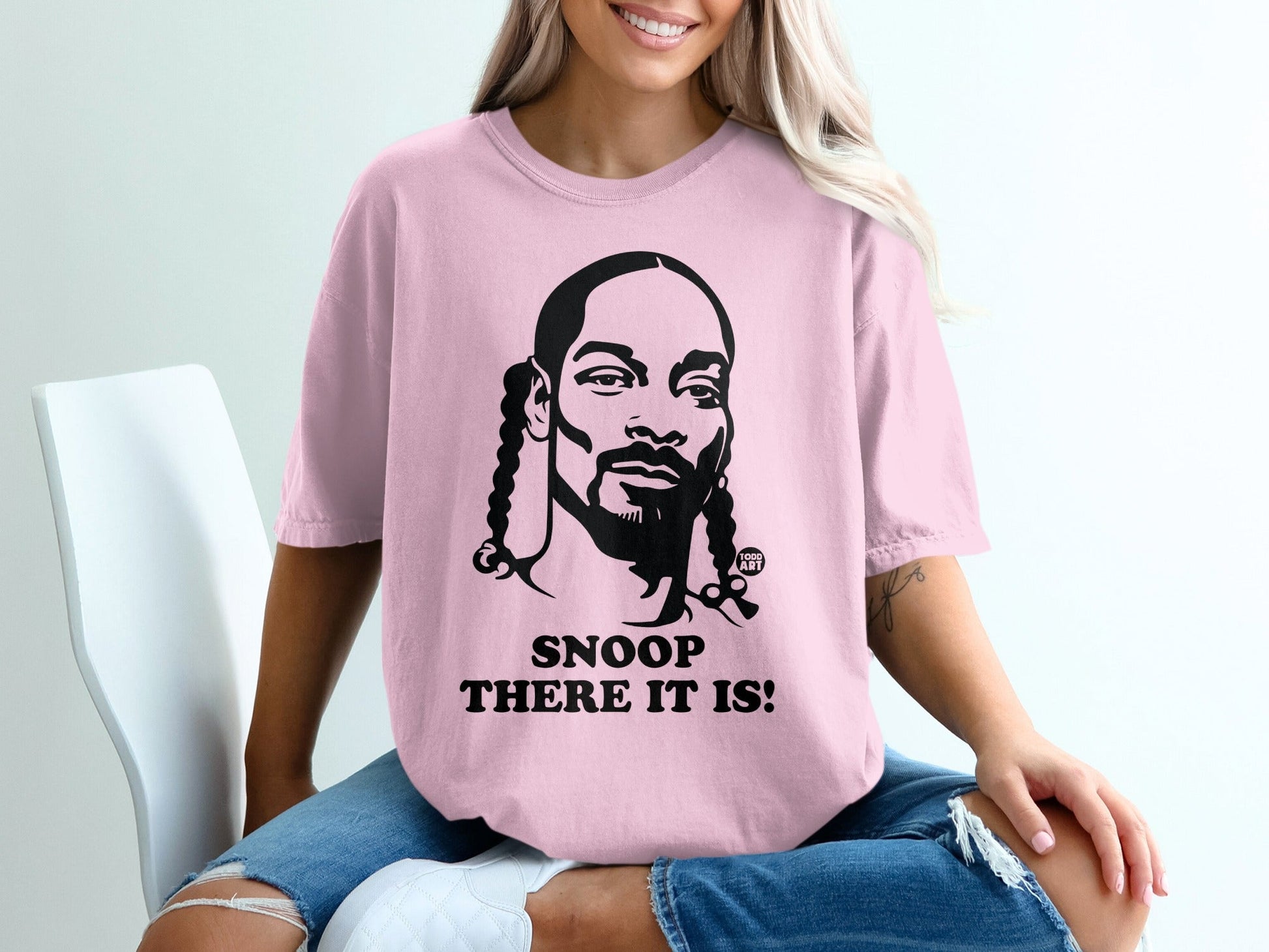 Pink t-shirt with Snoop Dogg graphic and "Snoop There It Is!" text.