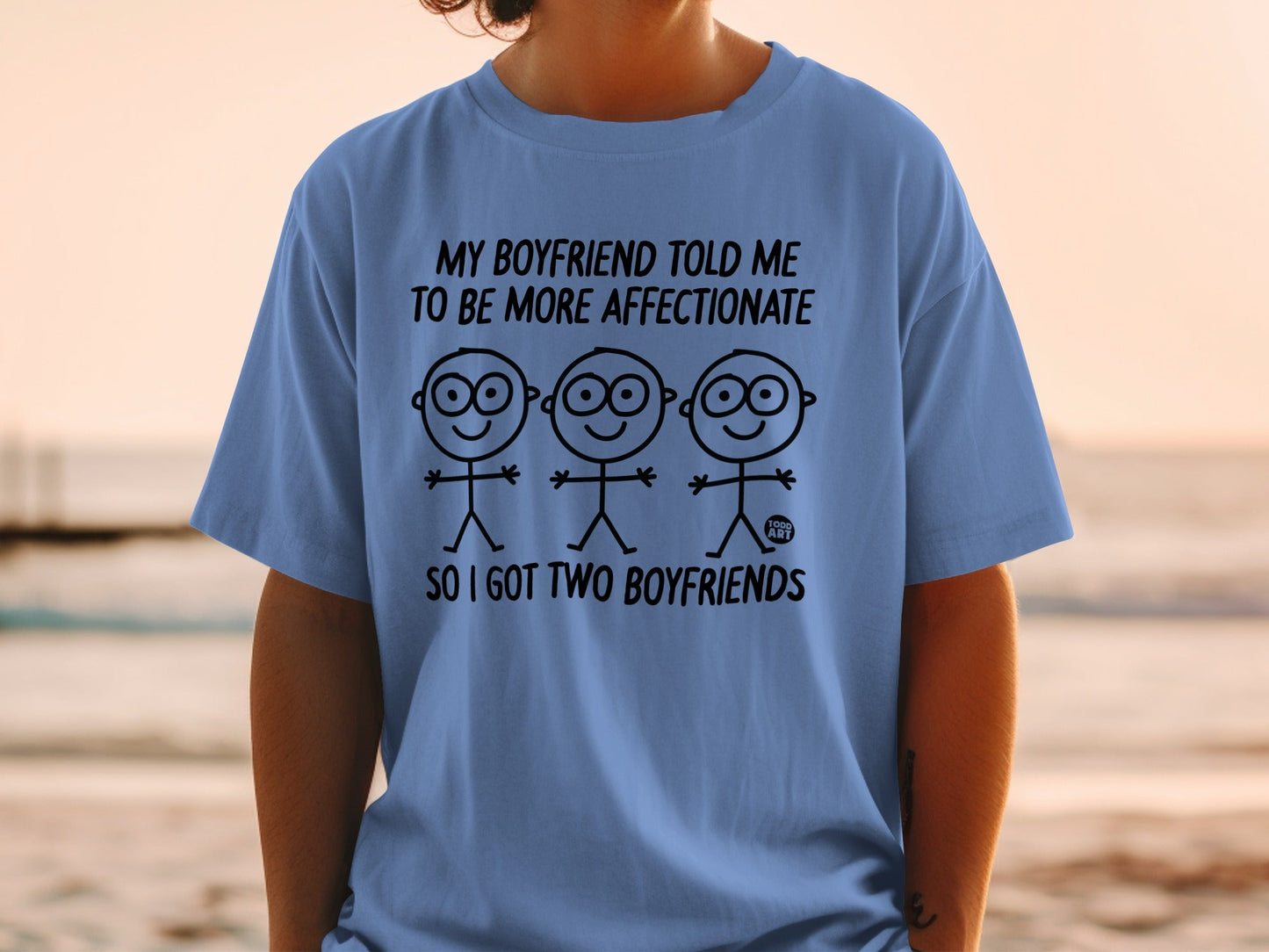 Blue t-shirt with text "My boyfriend told me to be more affectionate so I got two boyfriends".