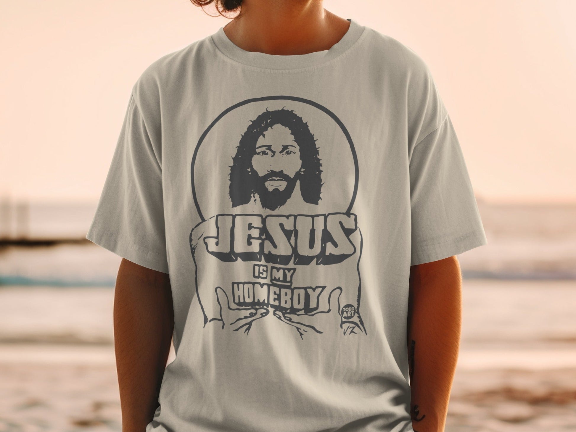 Gray t-shirt with "Jesus is My Homeboy" text and Jesus illustration.