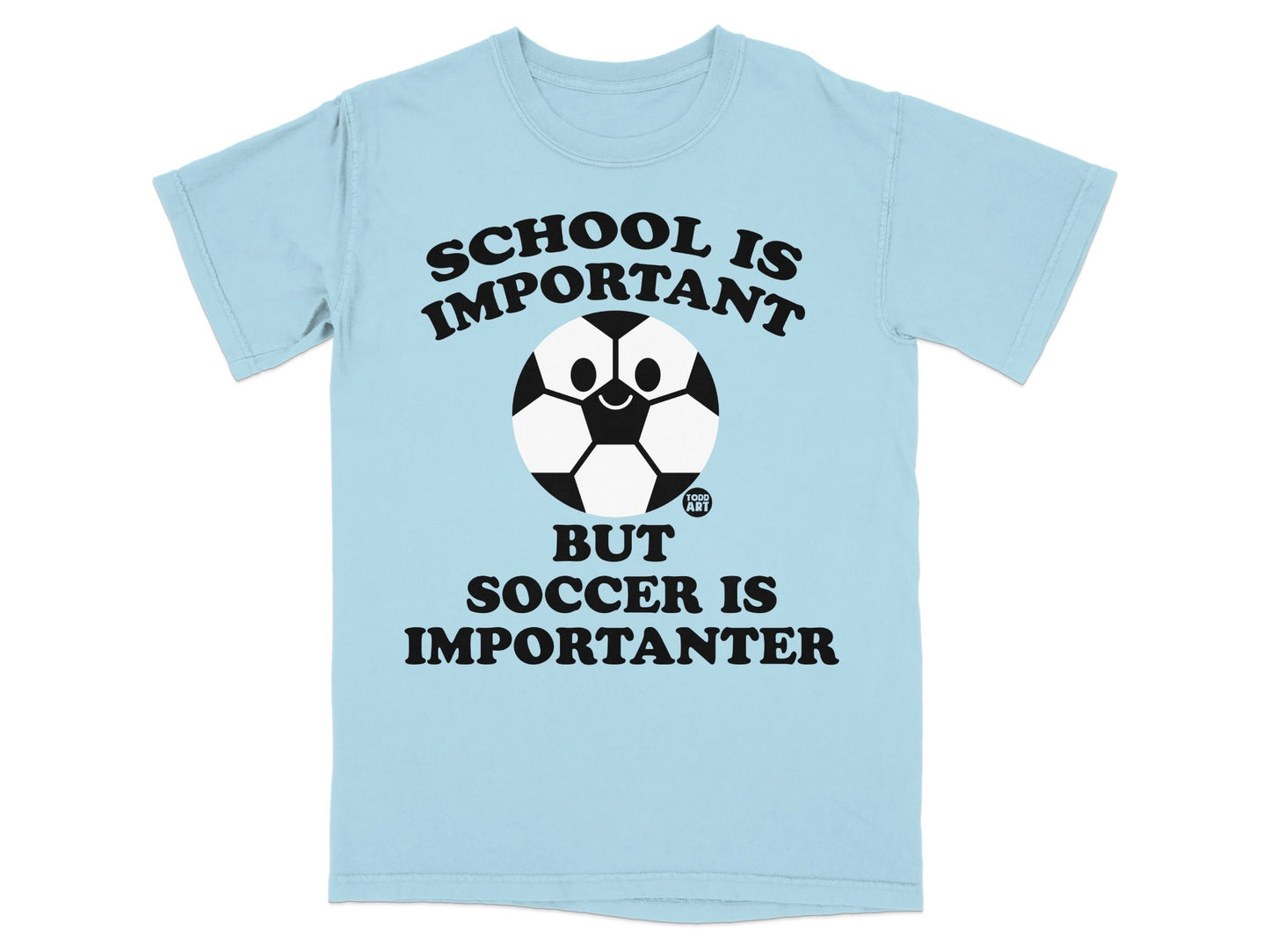 Light blue t-shirt with "SCHOOL IS IMPORTANT BUT SOCCER IS IMPORTANTER" and a smiling soccer ball.