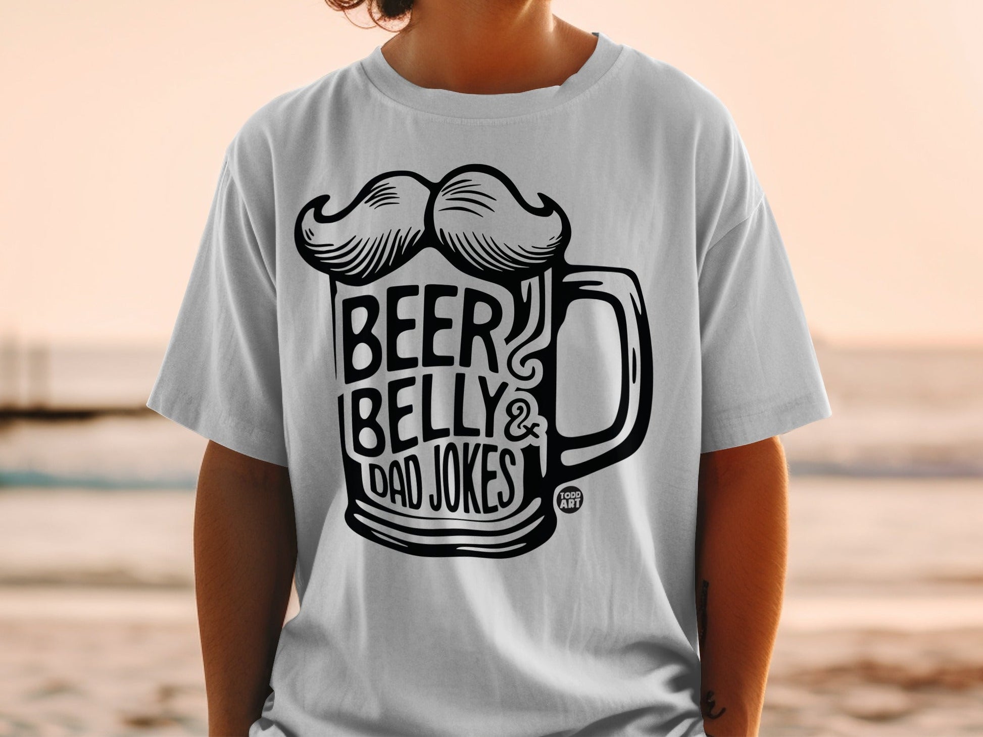White t-shirt with "Beer Belly & Dad Jokes" text and mustache graphic.
