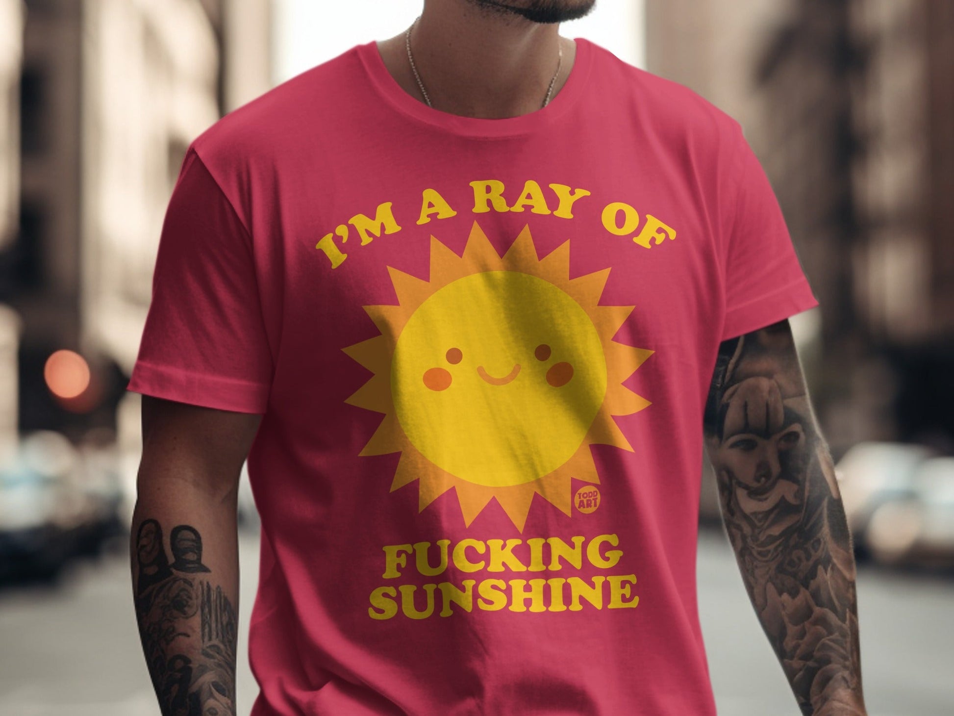 Crimson t-shirt with yellow sun graphic and text "I'm a ray of fucking sunshine".