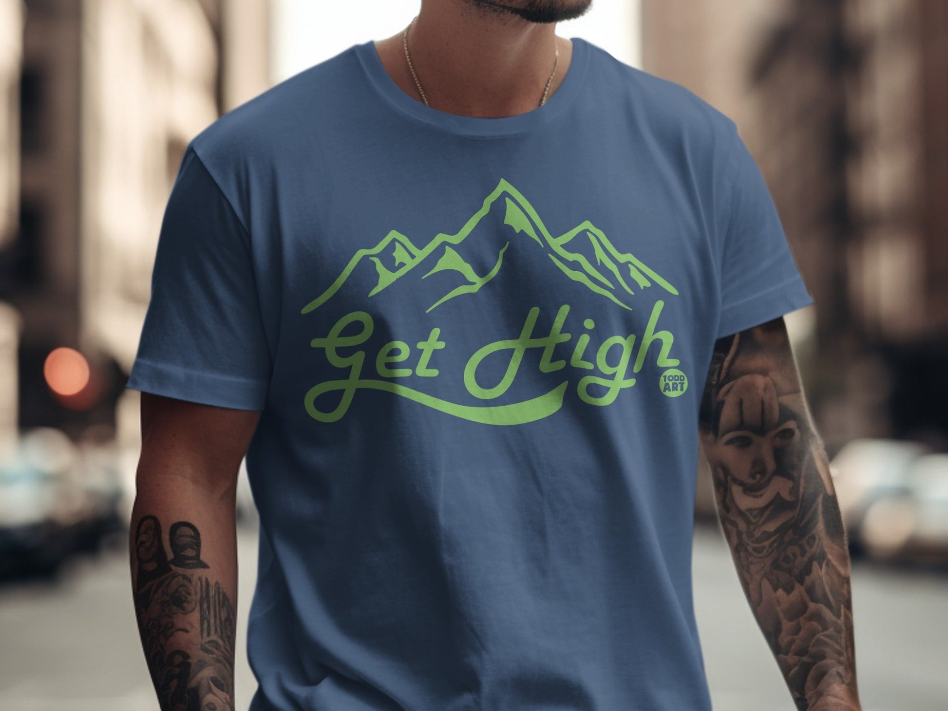 Blue t-shirt with "Get High" text and green mountain illustration.