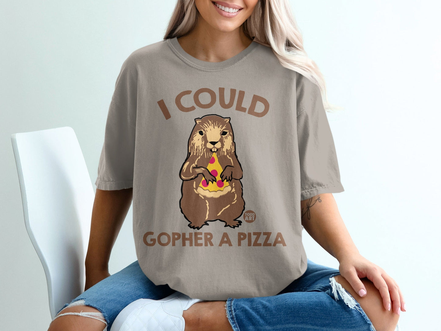 T-shirt with text "I COULD GOPHER A PIZZA" and illustration of a gopher holding pizza.
