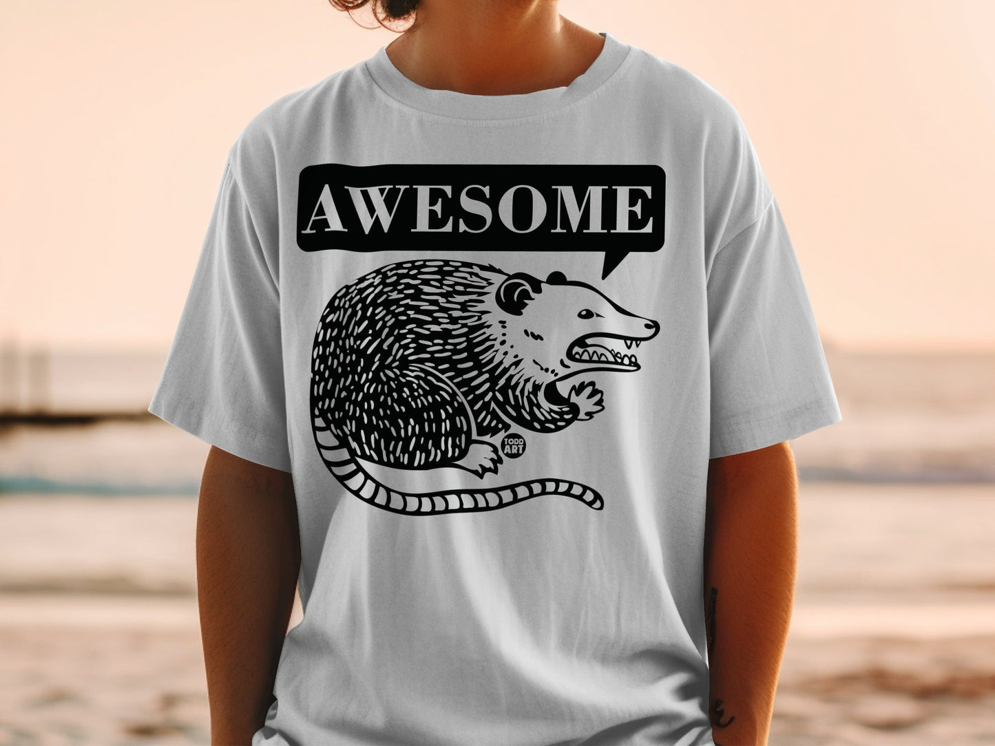 T-shirt with a cartoon possum and "AWESOME" text in a speech bubble.