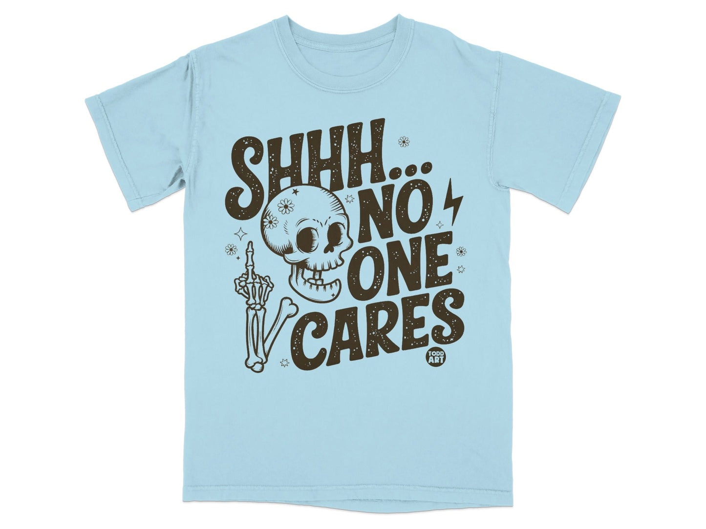 Light blue t-shirt with "SHHH... NO ONE CARES" text, skull, and skeleton hand.