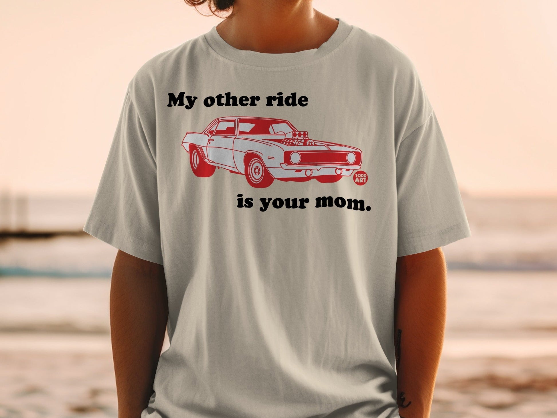 T-shirt with red graphic of a classic car and text "My other ride is your mom."