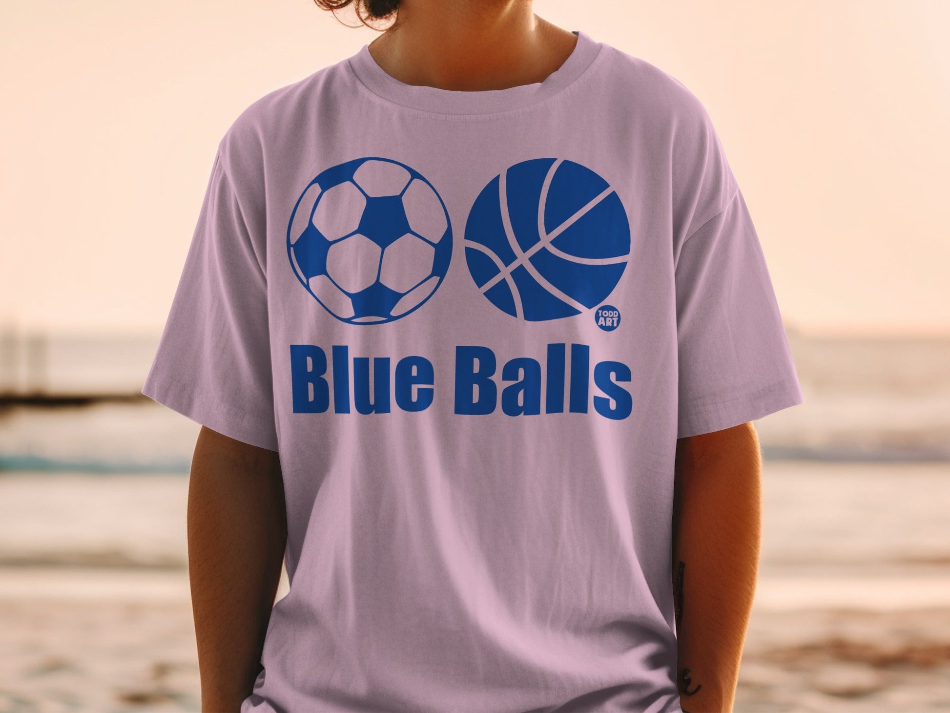 T-shirt with "Blue Balls" text and soccer and basketball graphics.