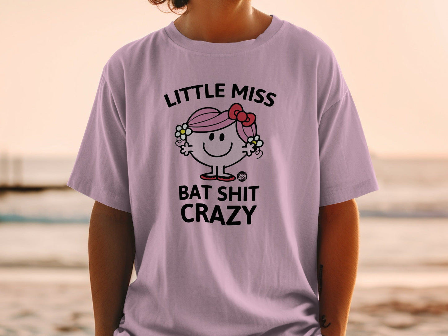 Light purple t-shirt with "Little Miss Bat Shit Crazy" graphic.