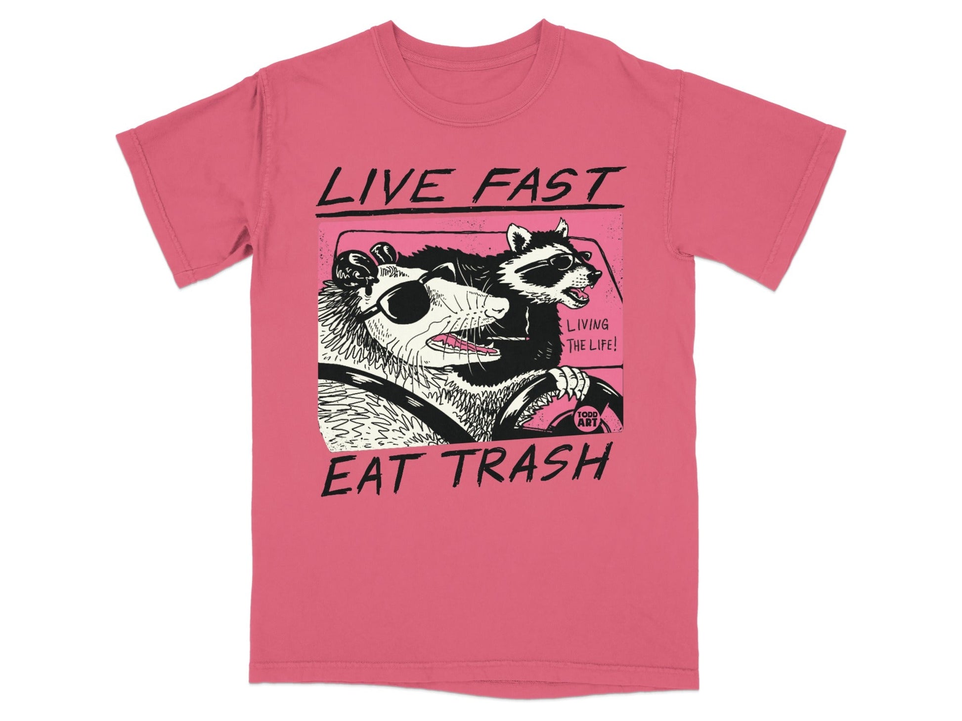 T-shirt graphic of a possum and raccoon driving, "Live Fast Eat Trash".