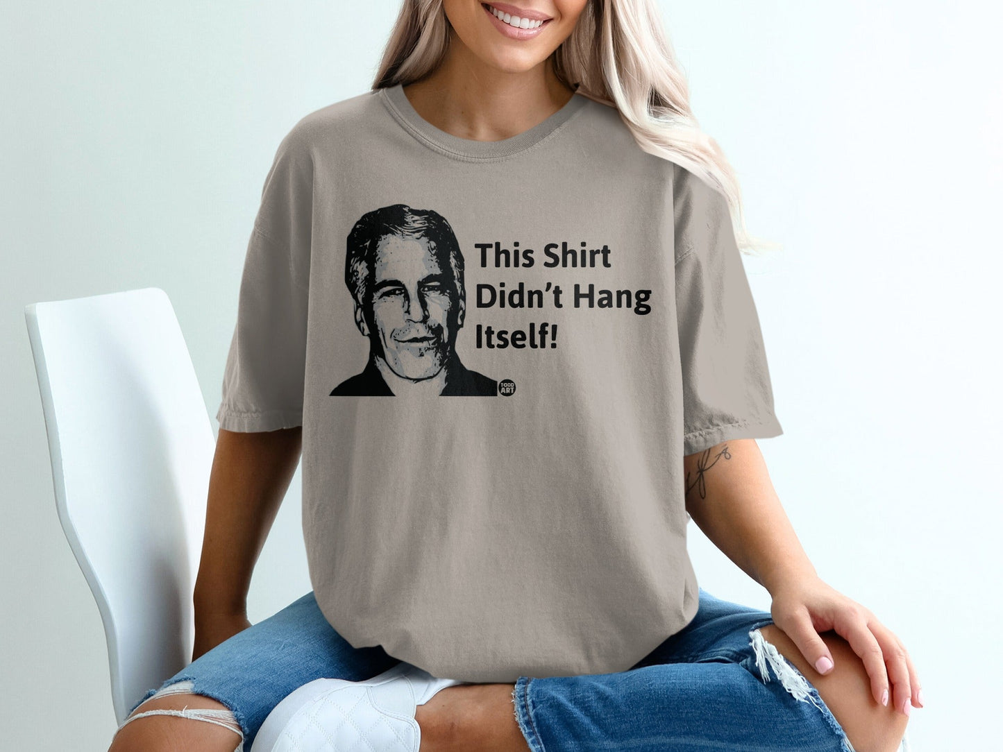 T-shirt with portrait of smiling man and text "This Shirt Didn't Hang Itself!".