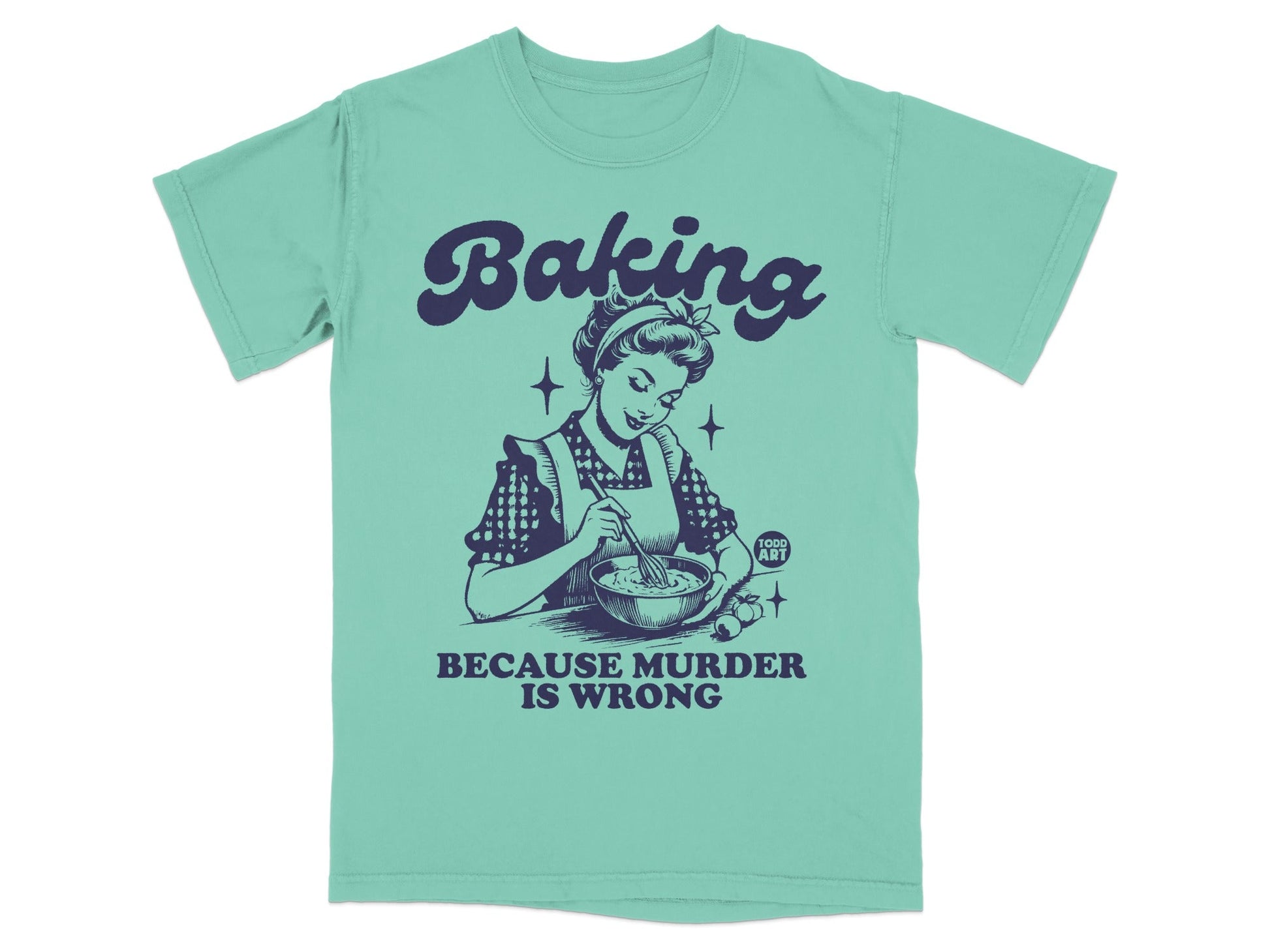 Mint green t-shirt with "Baking Because Murder is Wrong" and vintage illustration of a woman baking.