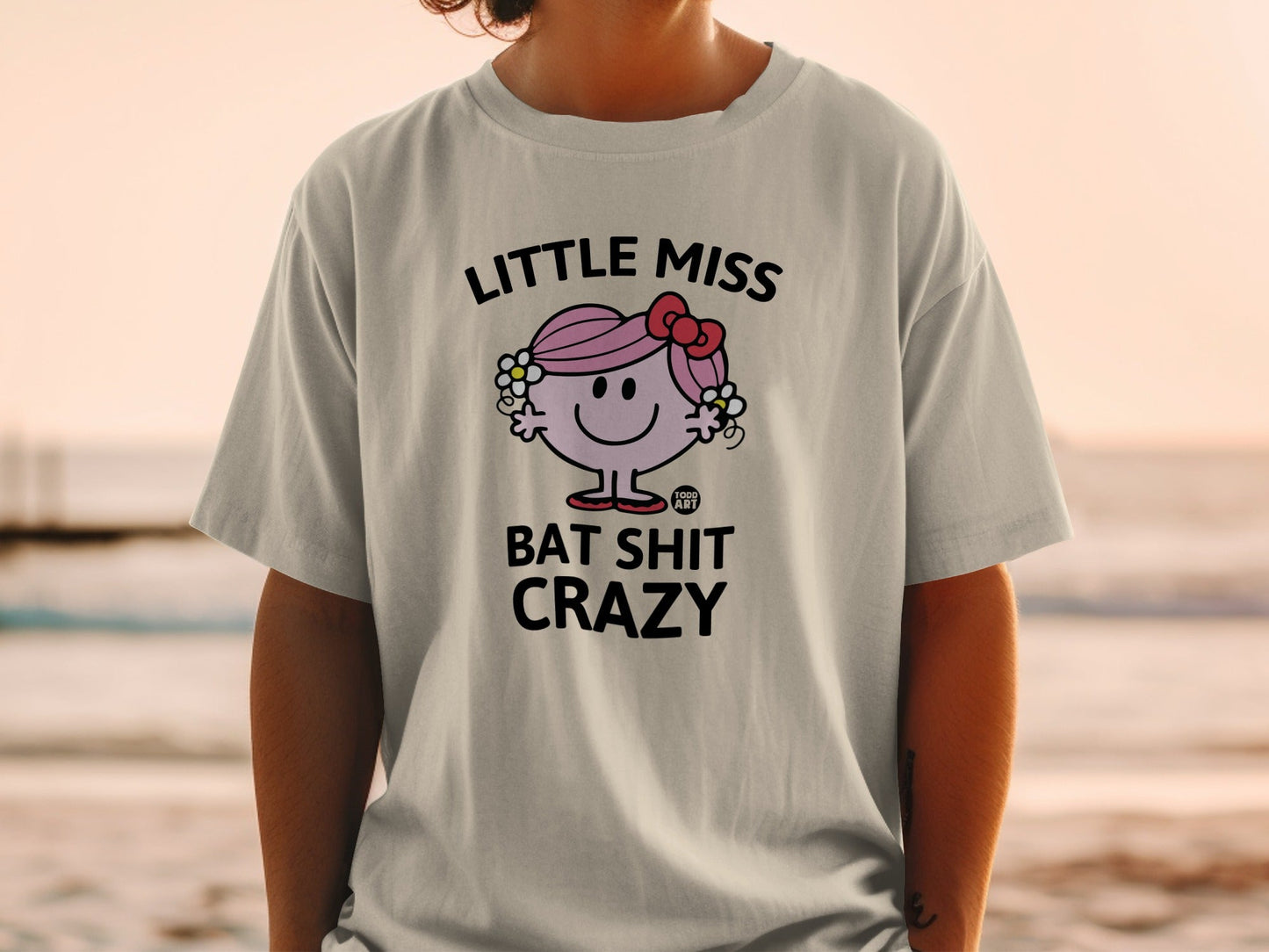 Little Miss Bat Shit Crazy t-shirt with a cartoon character and text.