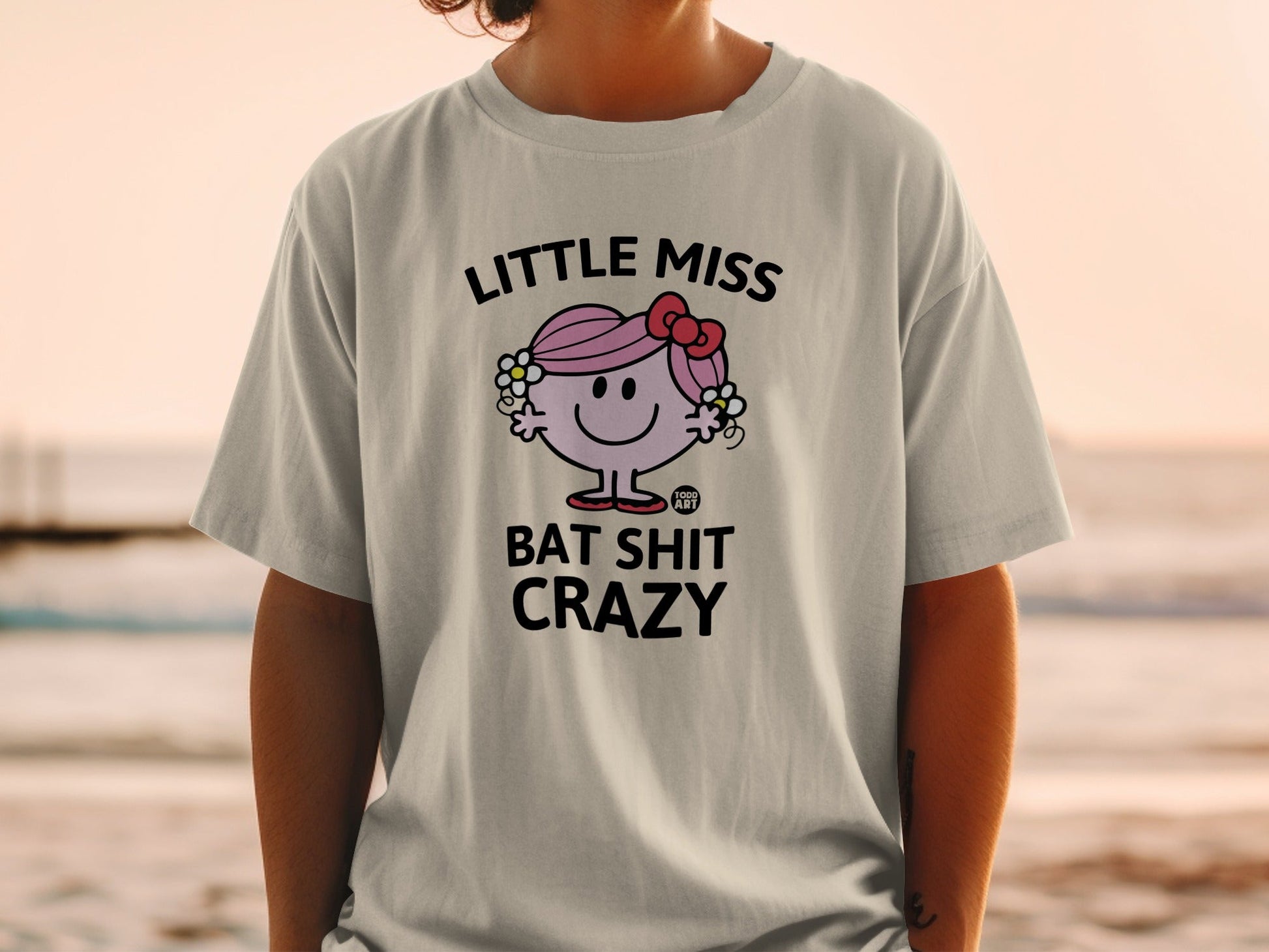 Little Miss Bat Shit Crazy t-shirt with a cartoon character and text.