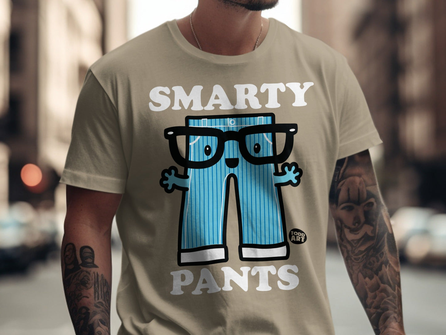 "Smarty Pants" graphic on a tan t-shirt with cartoon legs and glasses.