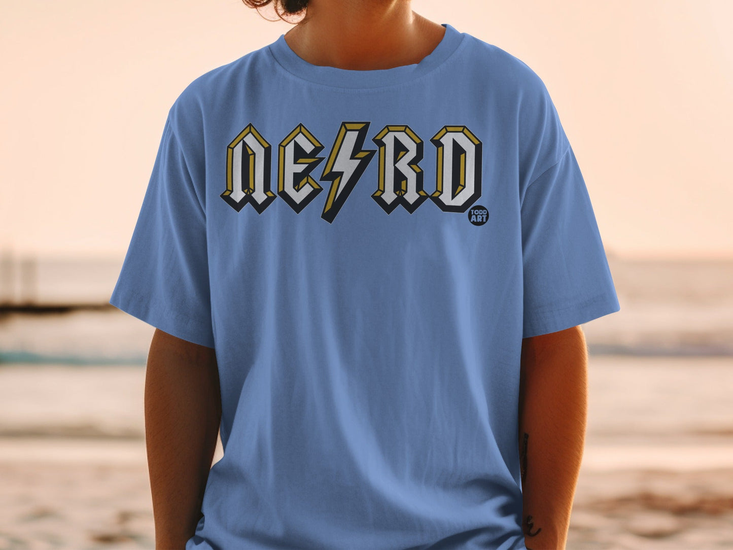 Blue t-shirt with "NERD" in lightning bolt style font and "100D ART" logo.