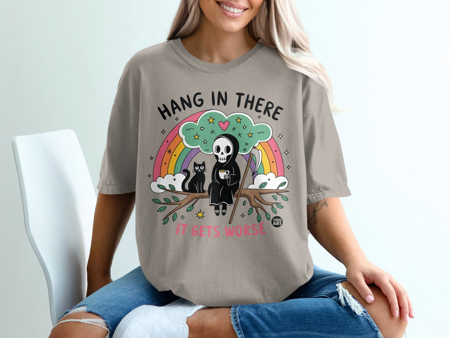 Grim reaper with a cat on a rainbow branch, holding coffee, with text.