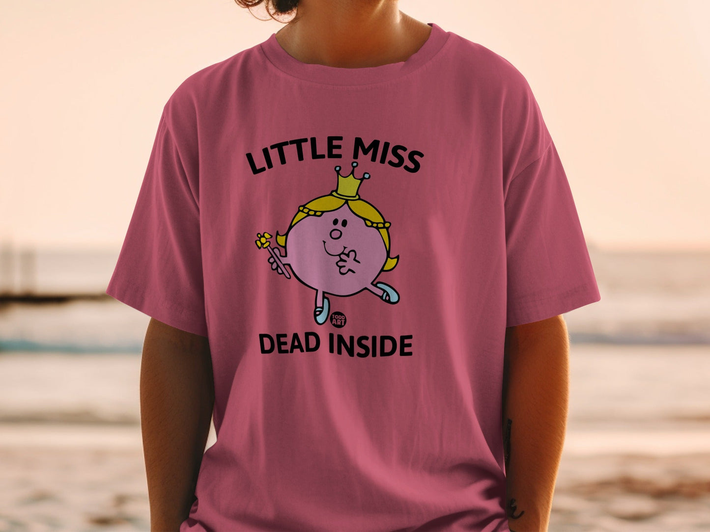 Pink t-shirt with "Little Miss Dead Inside" text and cartoon character.