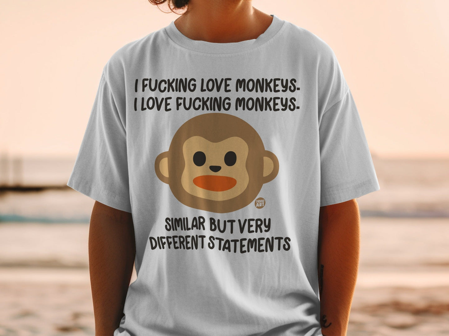 T-shirt with monkey graphic and text "I Fucking Love Monkeys." and "Similar but very different statements."