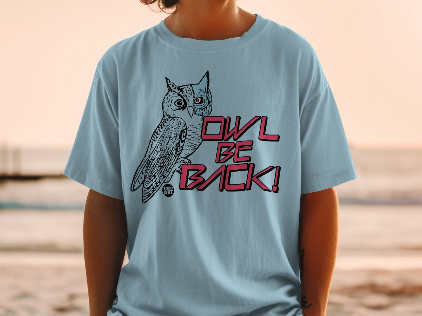 Light blue t-shirt with a cartoon owl and "OWL BE BACK!" text.
