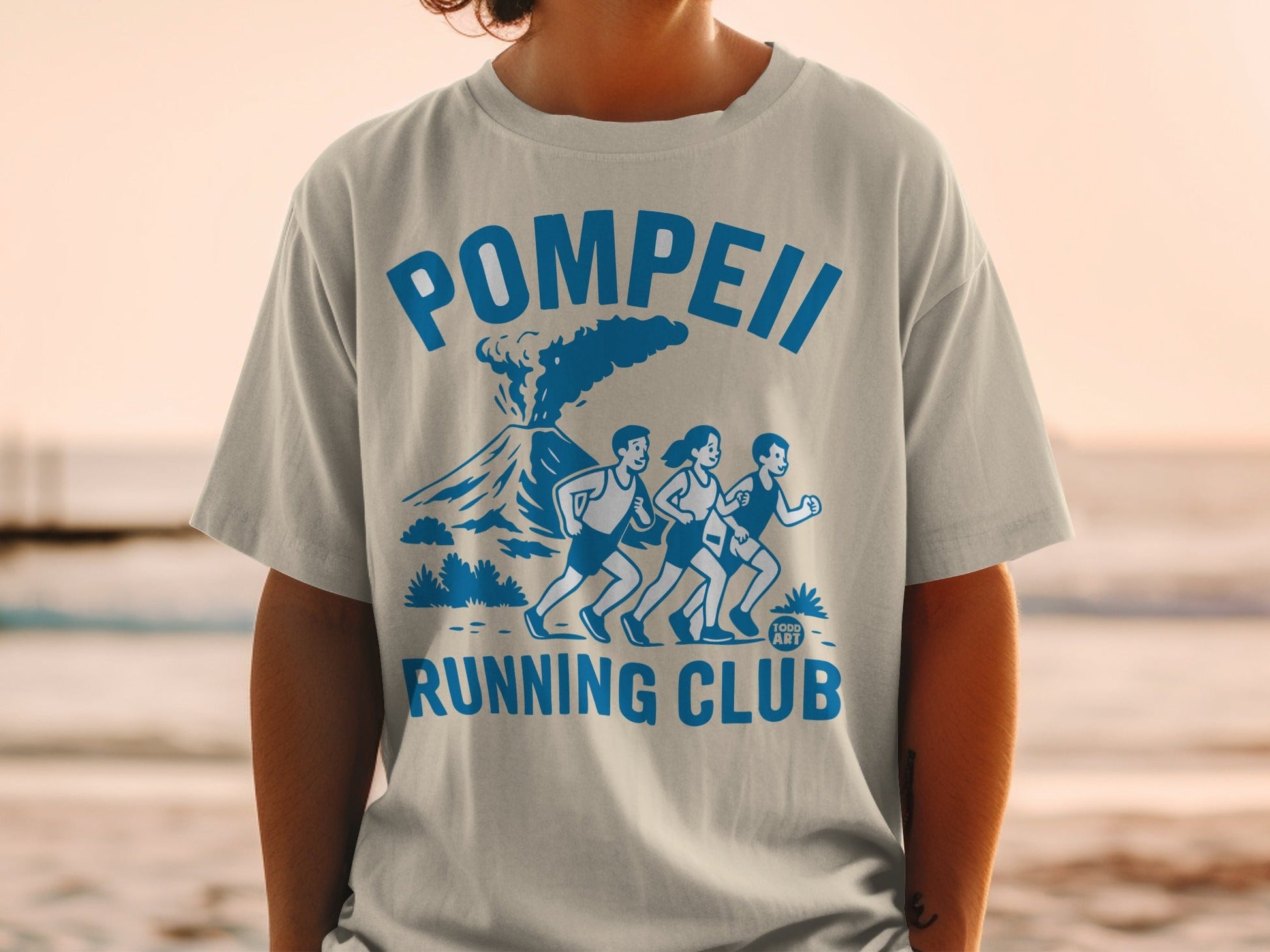 Pompeii Running Club graphic on a light blue t-shirt.