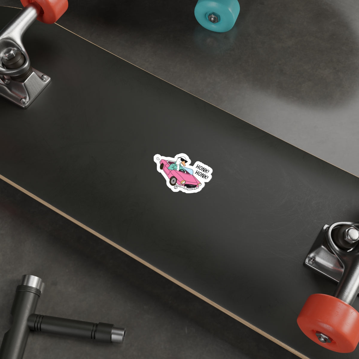 Funny Cartoon Sticker on Black Skateboard Deck