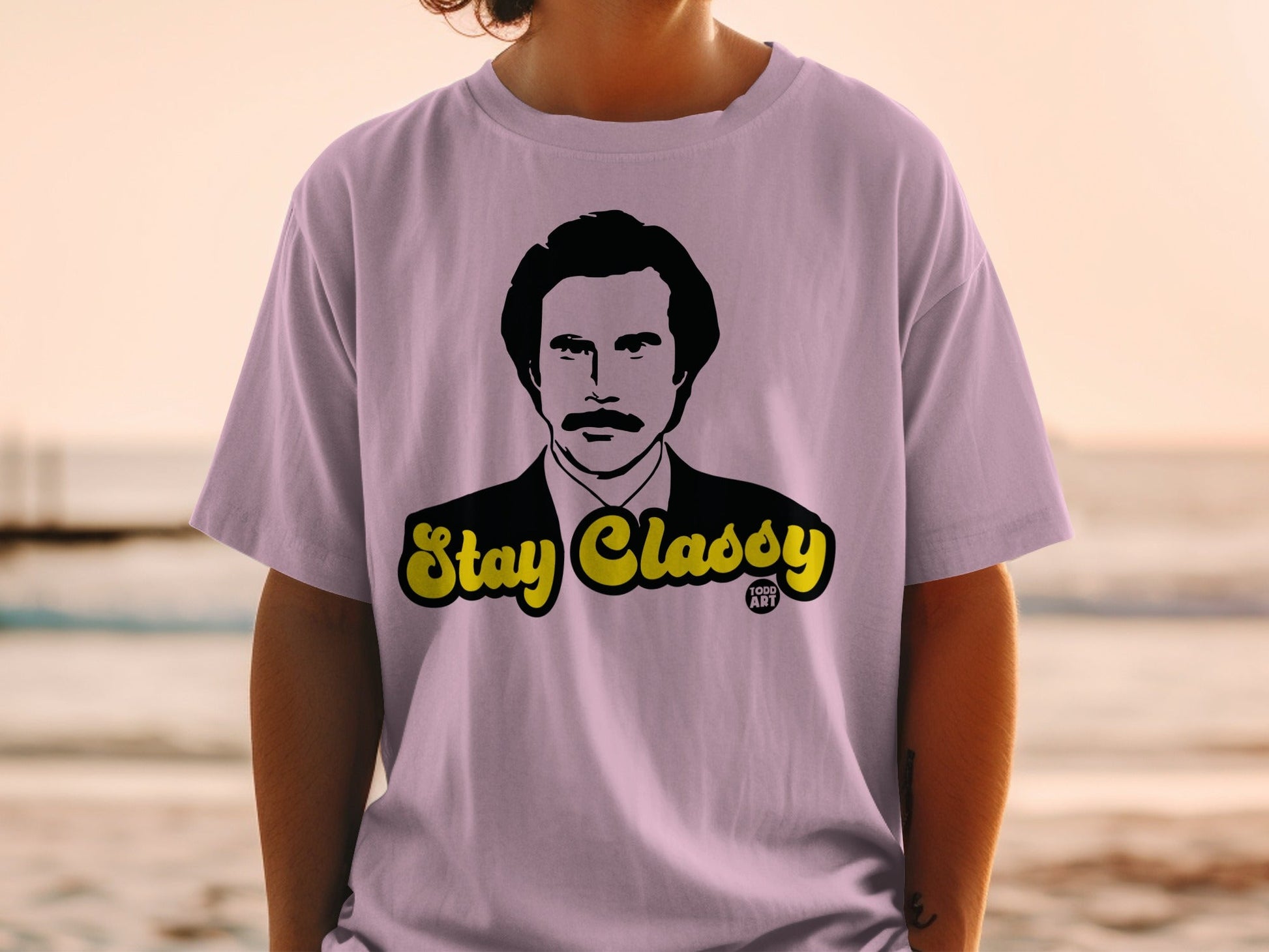 Ron Burgundy "Stay Classy" graphic on a lavender t-shirt.